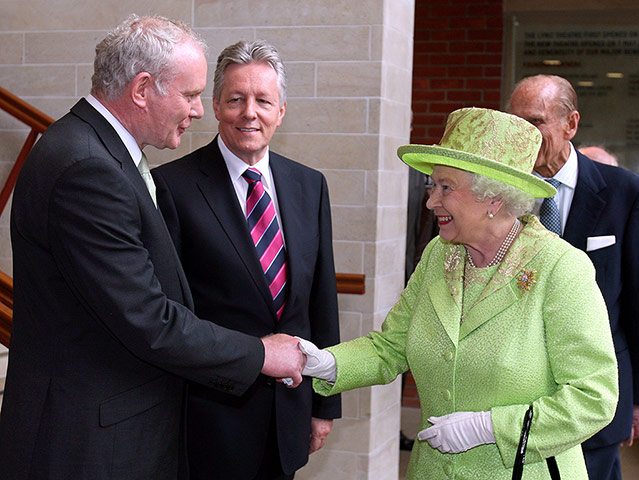 Picture desk live: The Queen shakes the hand of former IRA commander Martin McGuinness