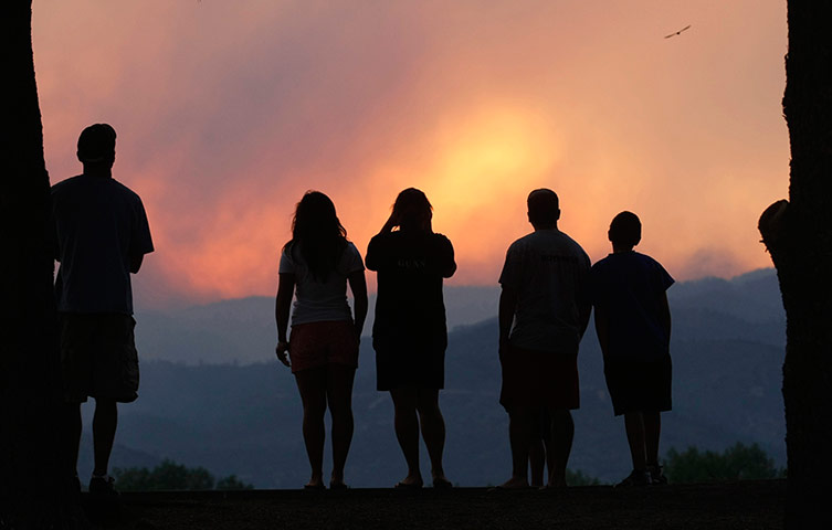 Wildfires in Colorado: People watch smoke rising from the Waldo Canyon Fire at sunset