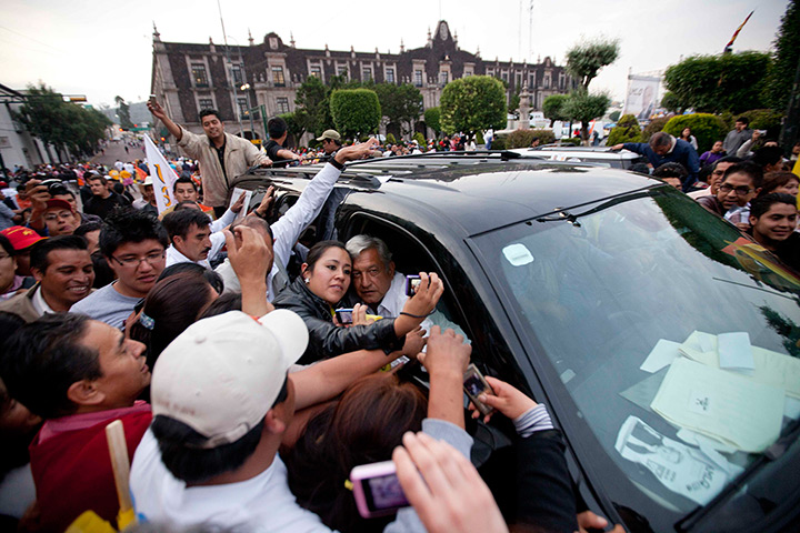 24 hours in pictures: Andres Manuel Lopez Obrador takes pictures with supporters during campaign