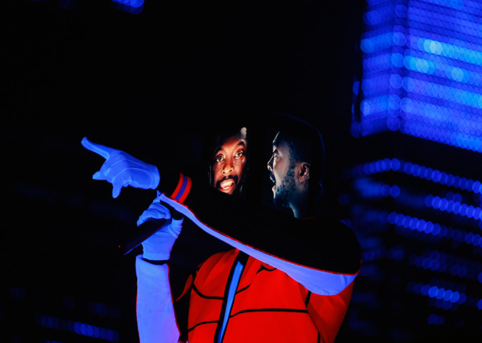 24 hours in pictures: Will.i.am wears headgear made up of three iPads depicting his fac