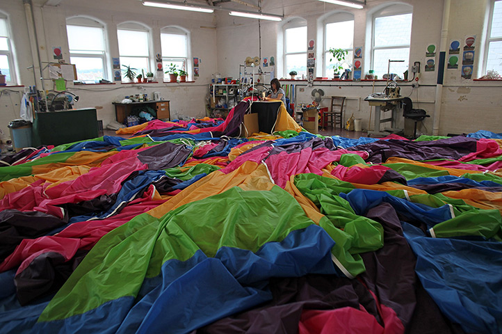24 hours in pictures: Seamstress Tina Kirk works on a hot air balloon envelope