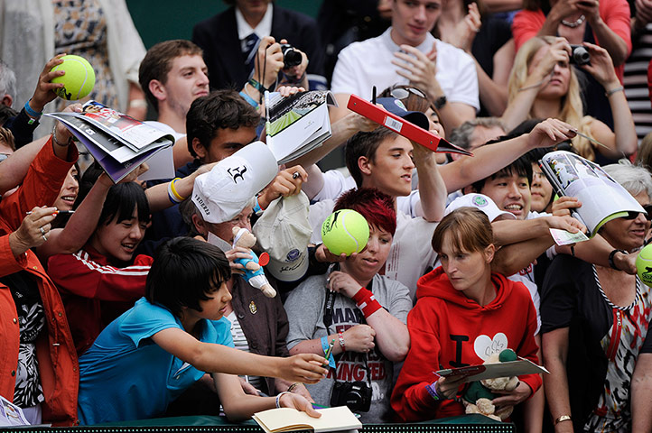 Wimbledon Day 3: Autograph hunters desperate to get to Roger Federer after his victory 