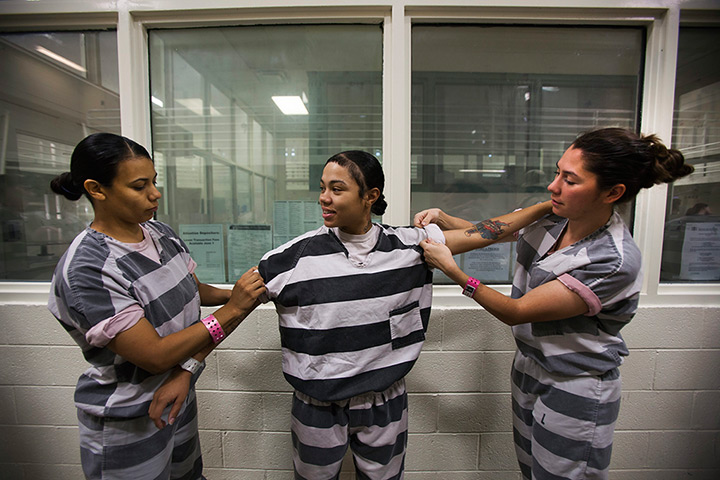 All-female chain gang: Inmates roll up their sleeves before a day's work