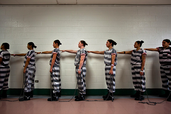 All-female chain gang: Inmates line up for work early in the morning at Estrella Jail