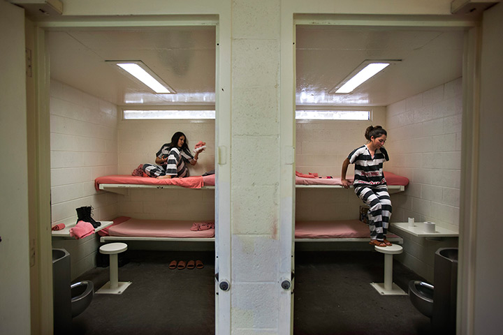 All-female chain gang: Inmates climb back in to their lockdown cells