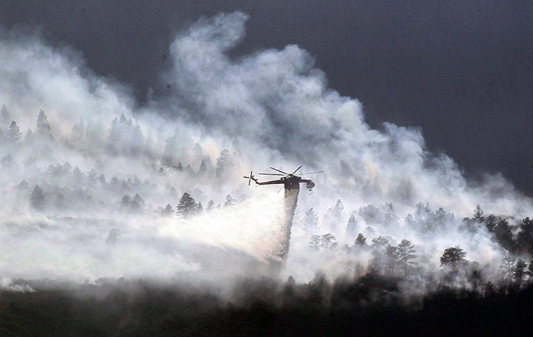 Colorado wildfire: A helicopter drops water on the Waldo Canyon fire