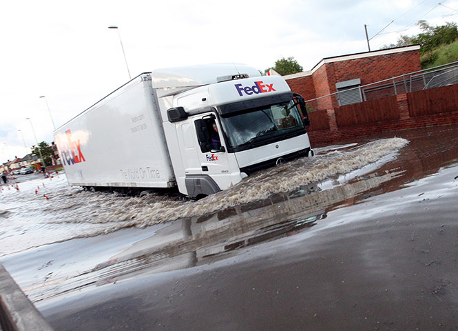 UK Flooding: Jarrow, Tyne and Wear: A lorry drives through floodwater