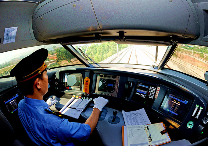 Picture desk live: A driver is pictured on a bullet train