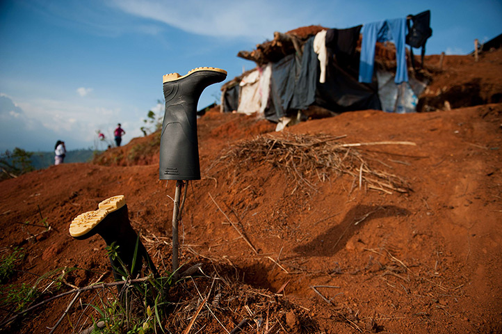 24 hours in pictures: Rubber boots are seen next to trenches