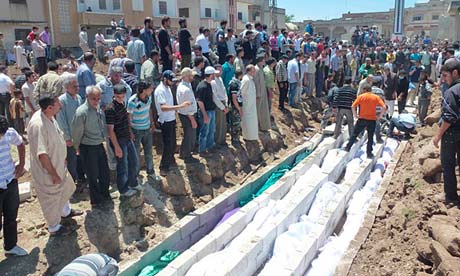 Mass burial for victims of Houla massacre