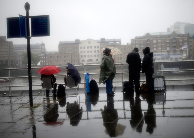 Jubilee pageant update: Spectators wait for the start of the pageant along the River Thames