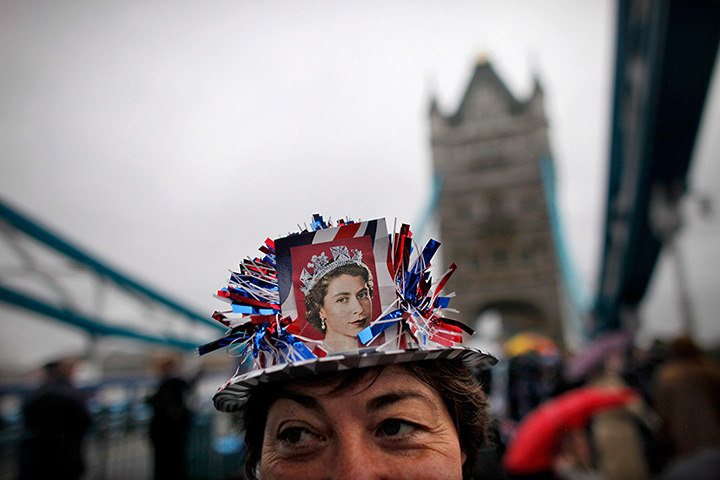Jubilee pageant update: Royal supporter waits in the rain on Tower Bridge