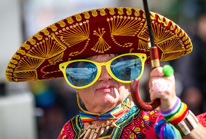 24 hours: Warsaw, Poland: A person takes part in a gay pride parade