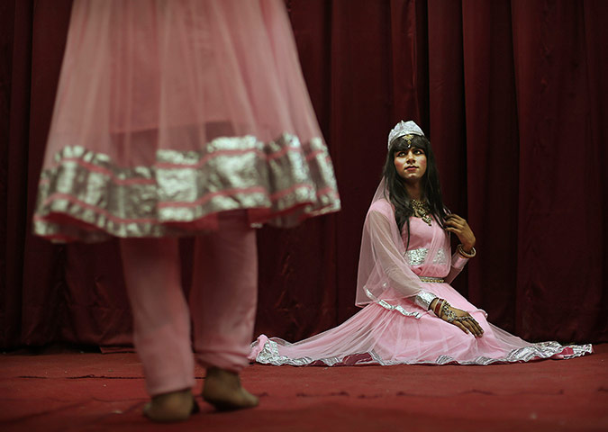 24 hours: New Delhi, India: Dancers from the transgender community