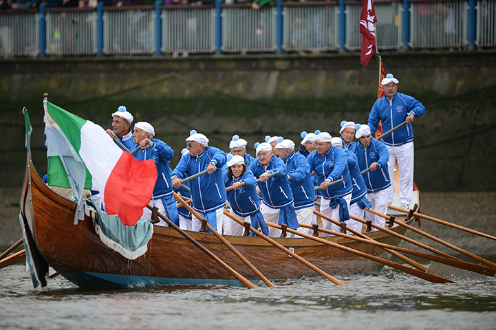 Jubilee boat pageant: Participants from Venice row a boat flying the Italian flag