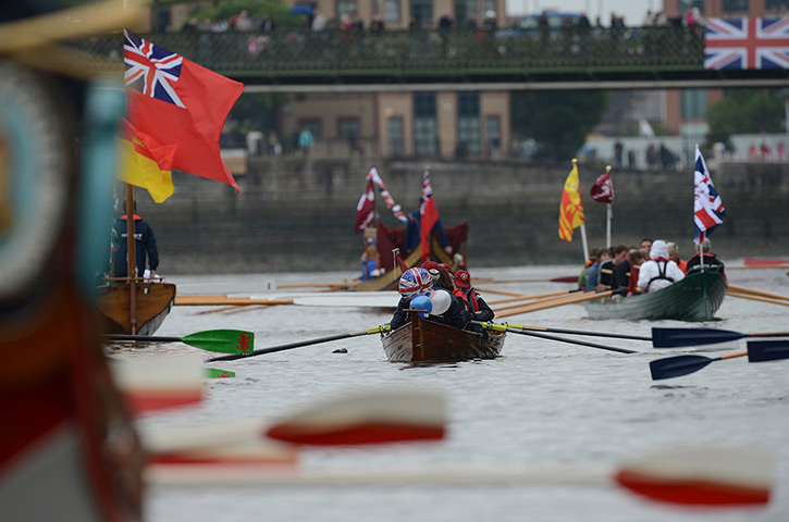 Jubilee boat pageant: Participants row a boat prior the start of Thames Diamond Jubilee Pageant