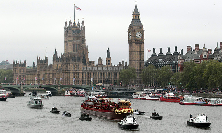 Jubilee Thames pageant: The Royal barge passes crowds lining the river near Houses of Parliament