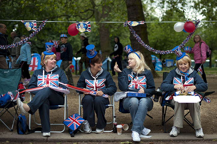 Diamond Jubilee day 2: Royal supporters sit on chairs with Union Jack decorations on the Mall 