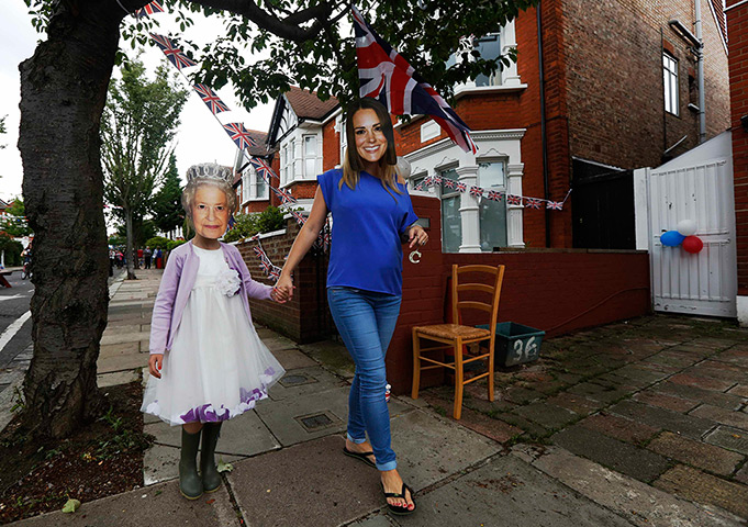 Diamond Jubilee day 2: A mother and daughter wear masks in Ealing, west London