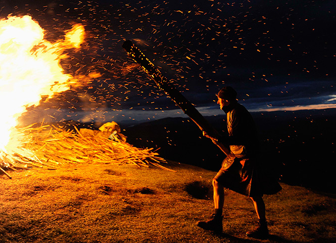 Jubilee beacons: Richard Teall feeds the beacon on  Ben y Brackie in Pitlochry, Scotland