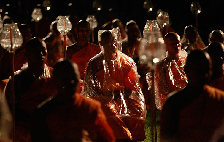 24 hours: Thailand: Buddhists monks meditate during a ceremony on Vesak Day