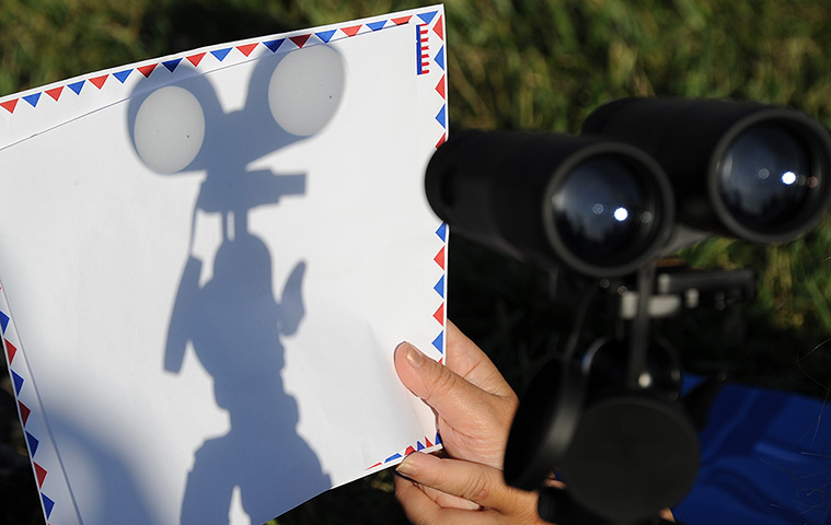 Transit Venus : The transit of Venus is projected through a pair of binoculars in LA