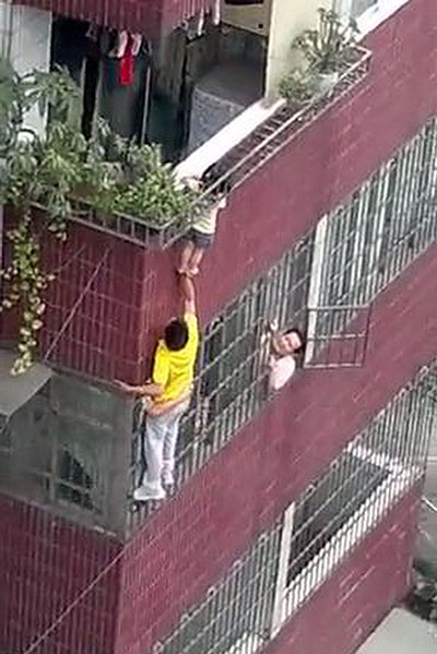 Picture Desk Live: Dangling toddler rescued 