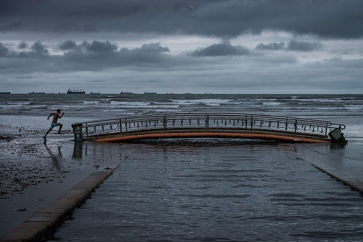 24 hours in pictures: A jogger in  Santos, Brazil: