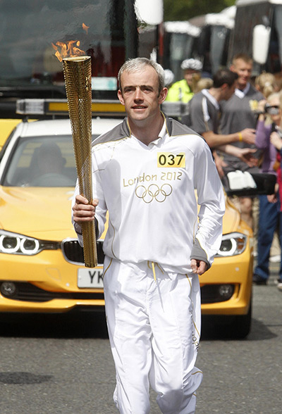 Torch relay day 19: Jockey Ruby Walsh carries the Olympic Flame through Dublin
