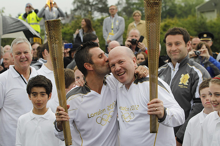 Torch relay day 19: Wayne McCullough and Michael Carruth at the torch handover