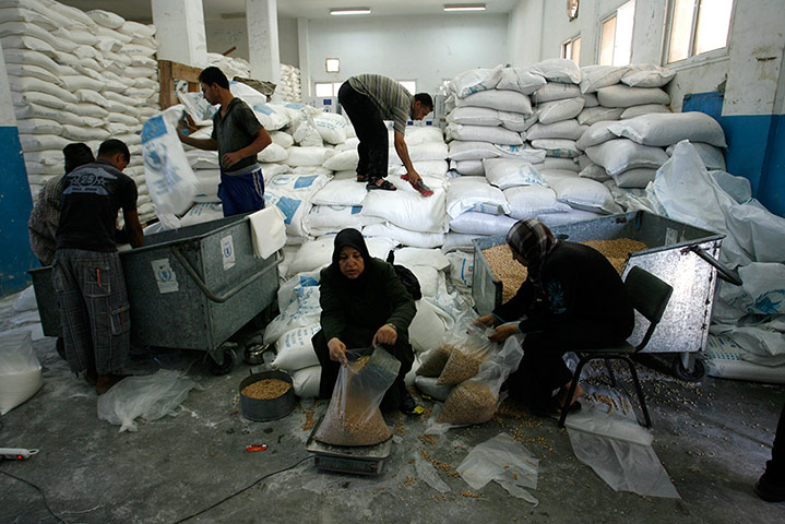 Gaza life: Workers prepare sacks of flour