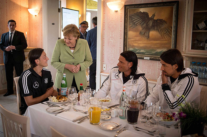 Picture Desk Live: Angela Merkel visits the German squad during a dinner in Gdansk Poland