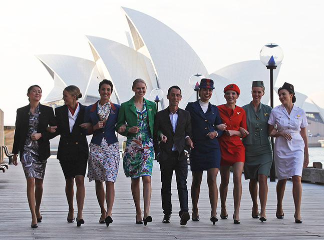 Week in Business: Designer Martin Grant walks with models wearing Qantas uniforms 
