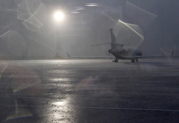 24 hours: An airplane is seen at the airport during a thunderstorm in Kiev