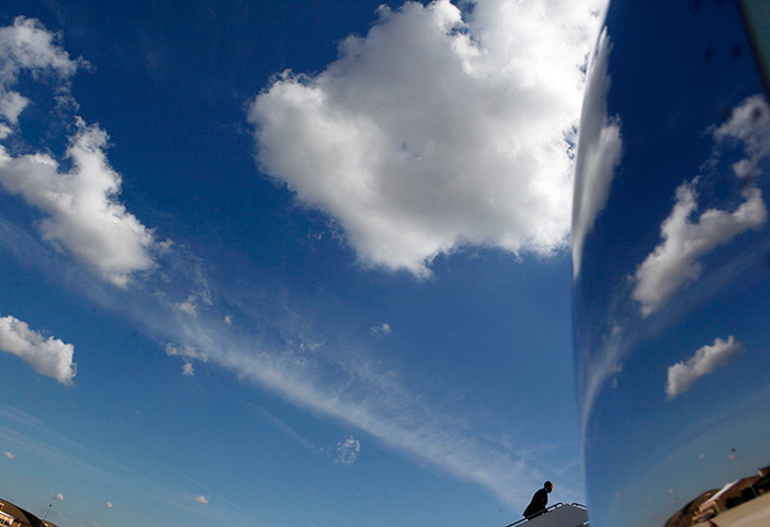 24 hours: Barack Obama walks up the stairs towards Air Force One