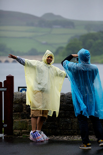 Picture Desk Live: Tourists wrapped up against the unseasonal weather
