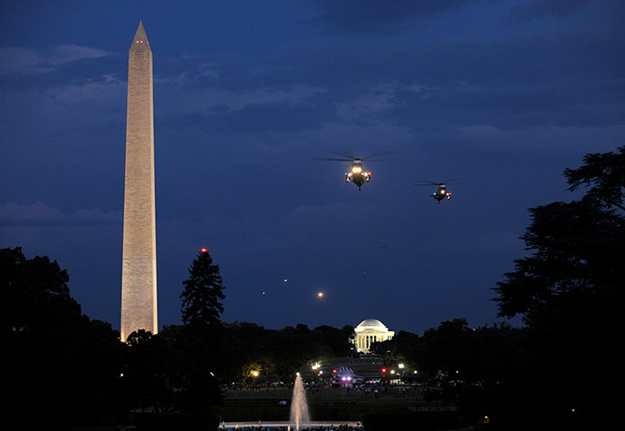 Picture desk live: Barack Obama on board helicopter