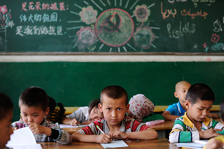 24 Hours: Xinjiang, China: Ethnic minority students study at a preschool in Aksu