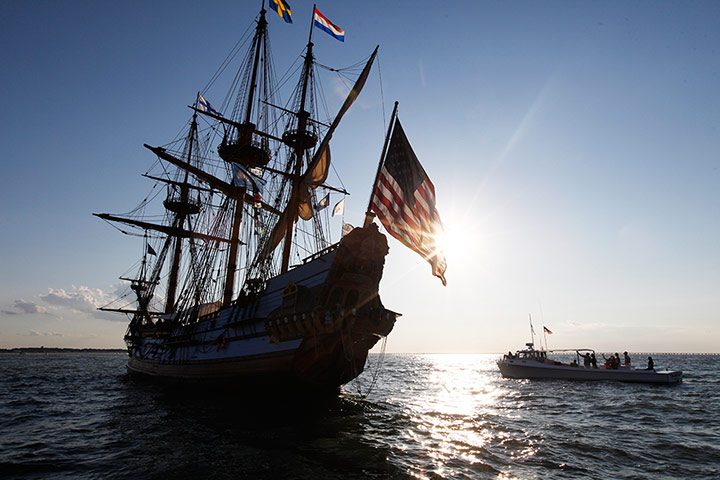 24 Hours: Virginia, US: A pleasure boat sails towards the tall ship Kalmar Nyckel