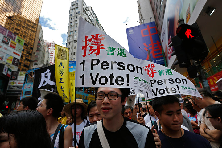 Hong Kong demonstrations: Protesters raise flags in a downtown Hong Kong street