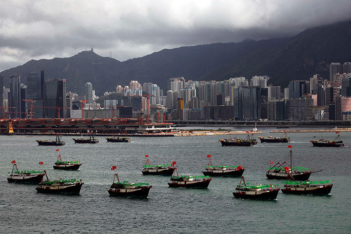 Hong Kong demonstrations: Fishing vessels bearing both Chinese and Hong Kong flags sail