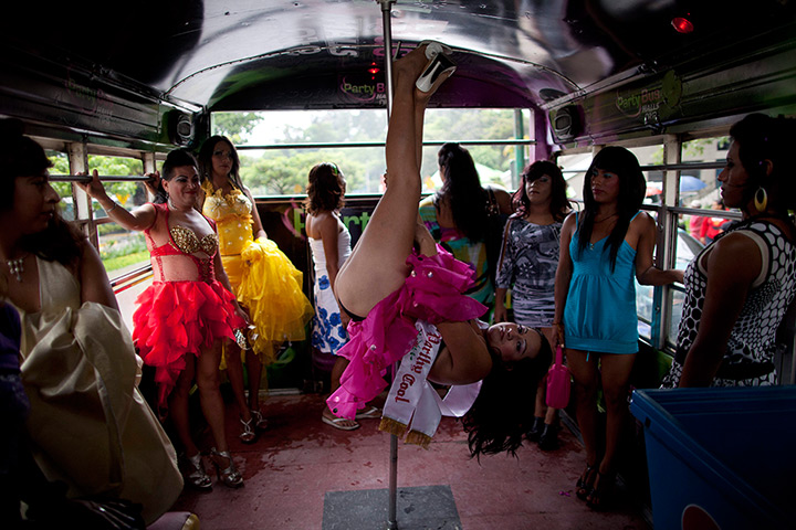 24 hours in pictures: Transgenders ride in a bus during gay pride parade in Guatemala City