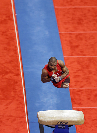 24 hours in pictures: John Orozco spins off the vault during the men's Olympic gymnastics trials