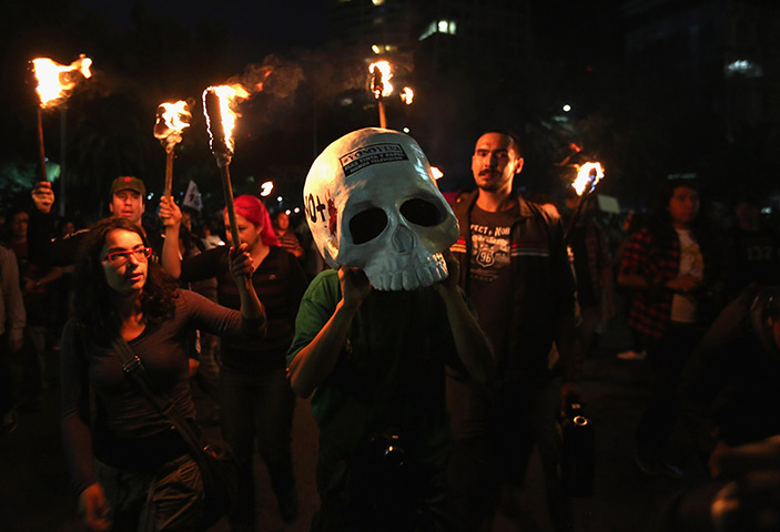 24 hours in pictures: Student protesters march the day before Mexicans go to the polls
