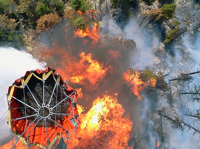 Wildfires in Colorado: The Nebraska National Guard dump buckets of water