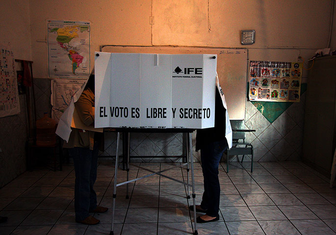 Mexico election: Ajijic, Jalisco: Women cast their votes at a polling station