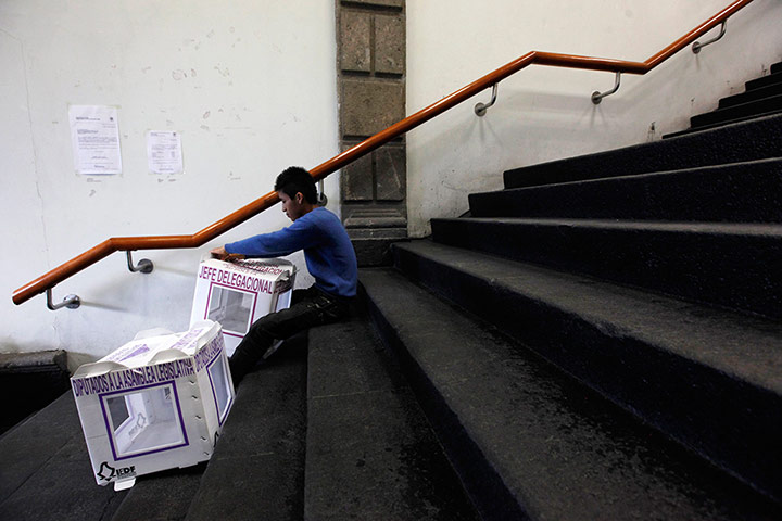 Mexico election: Mexico City: A man assembles boxes at a polling station
