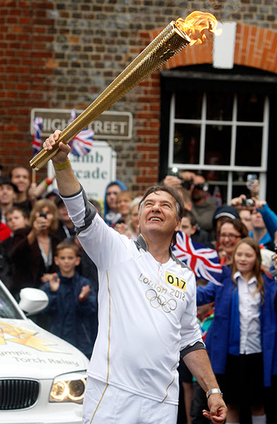 Picture desk live: Chef Raymond Blanc takes a turn as an Olympic torchbearer