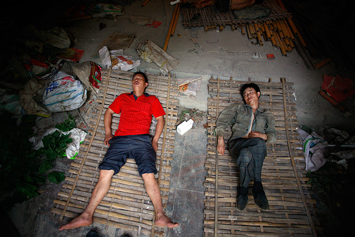 24 hours in pictures: Migrant labours sleep inside a construction site in Shanghai