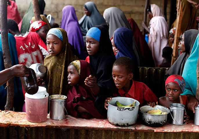 Somalia Goran Tomasevic: Children wait in line during a food distribution from an NGO in Mogadishu